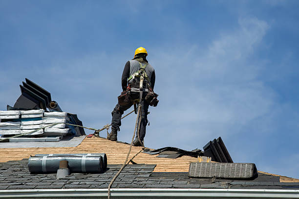 Professional Roof Replacement technician working in Clare, IA